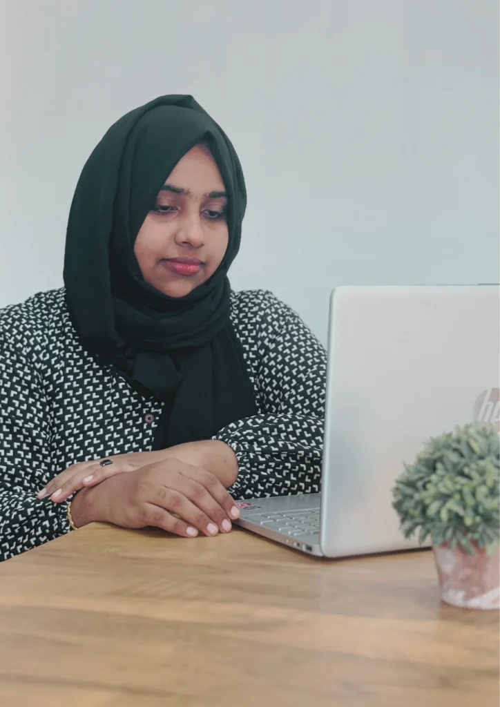 A girl typing looking to a laptop, showcasing the photo of the Best Freelance Digital Marketing Strategist in Calicut, Kerala.